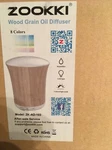 Zookki Wood Grain Oil Diffuser, Aromatherapy Cool Mist Humidifier, 8 Led Lights. Fixed Price $23.00.