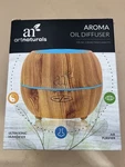Art Naturals Oil Diffuser. Blond Woodgrain Design. Appears Unused. Free Shipping. Fixed Price $19.95.