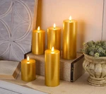 Home Reflections 5-PC Flameless Pillar Candles W/ Gift Box Gold Metallic. Fixed Price $35.99.