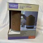 Better Homes & Gardens Cool Mist Ultrasonic Aroma Diffuser Woodgrain. Fixed Price $23.99.