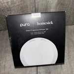 Pura 4 Homesick Smart Fragrance Diffuser Set W/ Santa's Workshop & Winter Mantel. Fixed Price $39.99.