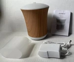 Zookki Wood Grain Oil Diffuser, Aromatherapy Cool Mist Humidifier, 8 Led Lights. Fixed Price $27.99.