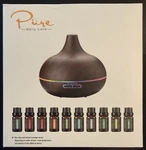 New Pure Daily Care Aromatherapy Ultra Sonic Diffuser + 10 Essential Oils - Dark. Fixed Price $16.95.