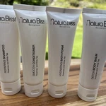 Natura Bisse Set Shampoo, Conditioner, Body Balm & Bath Foam 1.7 Fl Oz Size. Fixed Price $22.00.