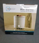 Mainstays Electric Wax Warmer White D 4.4". Fixed Price $12.99.