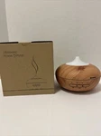 New Ultrasonic Aroma Diffuser Tan Wood Grain Lights Up Excelvan Model W/charger. Fixed Price $13.99.