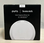 Pura 4 Smart Fragrance Diffuser With Santa's Workshop And Winter Mantel Refill. Fixed Price $38.00.