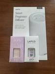 Pura Plus White Smart Fragrance Diffuser + 2 Scents Lavender Fields & Champagne. Fixed Price $54.99.