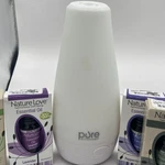 Enrichment Purespa Essential Diffuser Cool Mist With 5 Oils. Fixed Price $14.99.